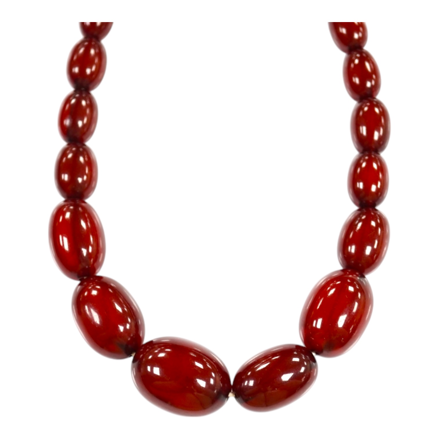 A single strand graduated oval simulated cherry amber bead necklace, 38cm, gross weight 41 grams. Condition - poor to fair